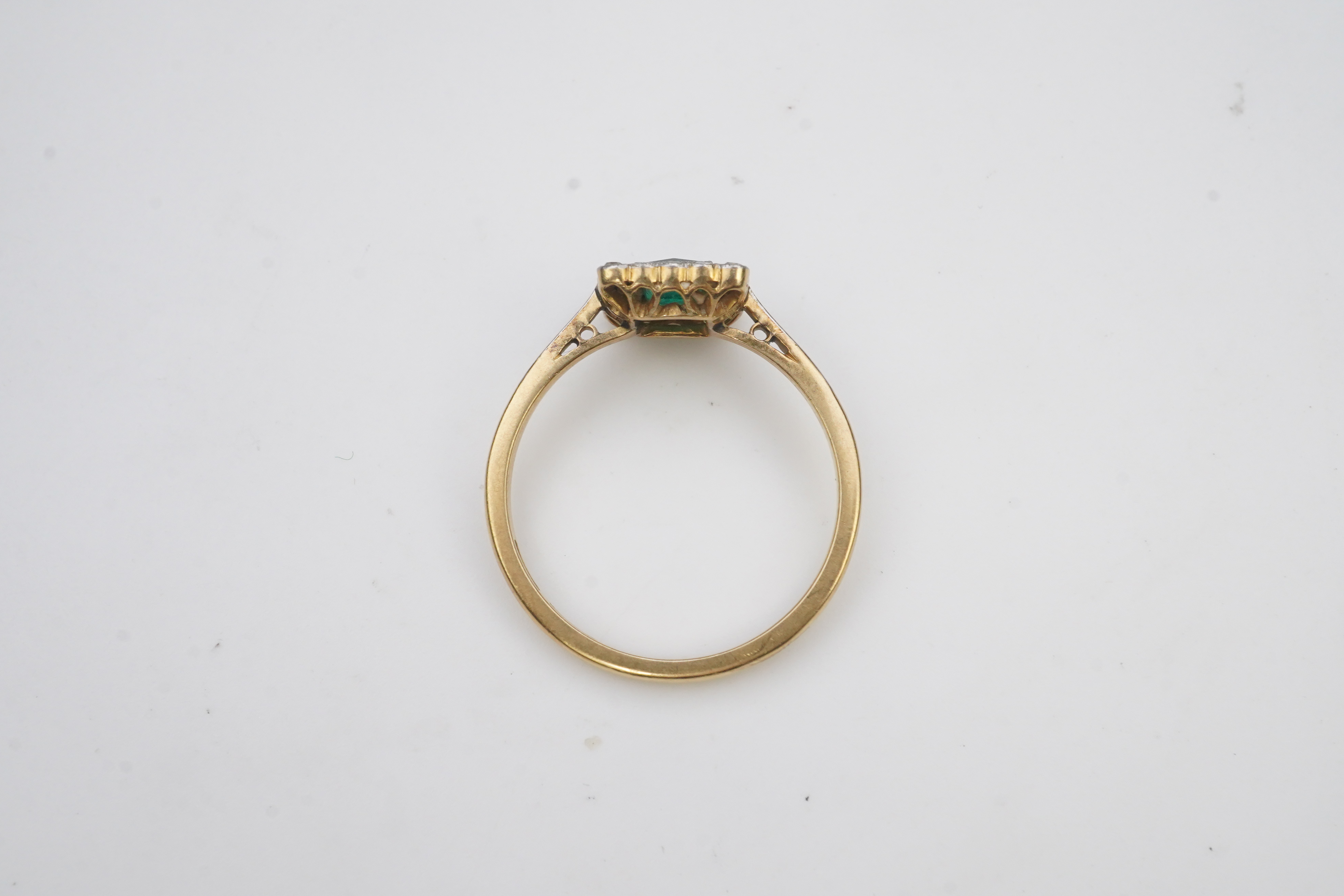 An emerald and diamond ring, early 20th century